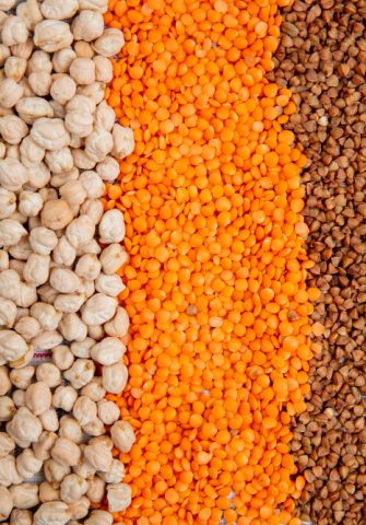 background-different-types-groats-corn-seeds-chickpeas-red-lentils-buckwheat-rice-top-view